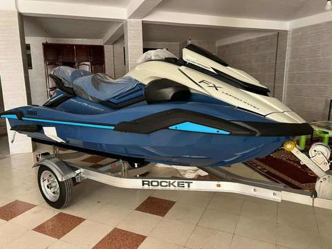 A 2025 Yamaha WaveRunner FX Cruiser SVHO Jetski in blue and white on a silver trailer showcasing its sleek design and modern features