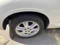 A 2005 Chrysler PT Cruiser with a focus on its wheel and tire featuring a chrome rim and Hankook tire brand