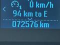 Dashboard display of a 2021 Ford Econoline showing speed at 0 km/h fuel range of 94 km to empty and total distance of 072576 km