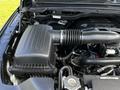 A close-up of the engine compartment of a 2019 RAM 1500 showing the air intake system and surrounding components