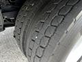 Close-up of a tire on a 2006 Hino 268 showing tread wear and detailing of the tire surface