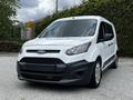 A white 2016 Ford Transit Connect van is positioned in the foreground featuring a black front grille and headlights