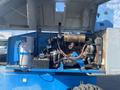 A 1997 Genie S-65 4X4 with an open engine compartment revealing various components including pipes and electrical parts