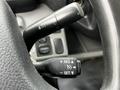 Close-up of the cruise control lever on the steering column of a 2014 Hino 195 featuring buttons for setting adjusting and canceling the cruise control