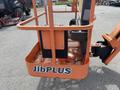 A 2009 JLG E300AJP aerial work platform with an orange basket featuring the label JibPLUS and a control panel in the seat area