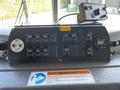 Dashboard of a 2006 Emergency One Fire Truck featuring various control switches a gauge and a warning sign