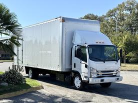 A 2019 Isuzu NRR box truck with a white exterior and a large cargo area is parked with its front slightly angled to the left