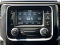 The image shows a dashboard display from a 2016 RAM 2500 featuring radio settings and a digital screen showing the FM station 94.5
