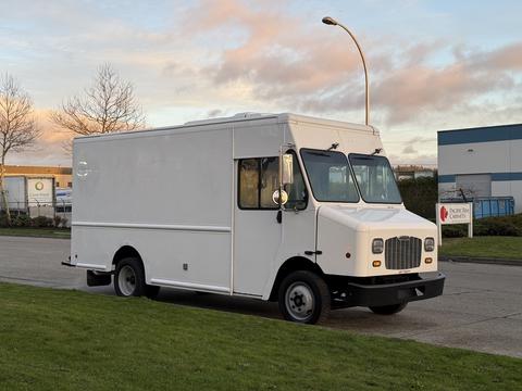 A white 2017 Freightliner M Line delivery truck with a boxy design and large front windows parked on a street