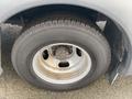 A close-up of a tire on a 2017 Chevrolet Express showing the wheel rim and tread pattern