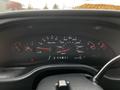 Dashboard of a 2004 Ford Econoline showing speedometer fuel gauge and odometer with needle indicators and digital readout