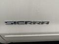 The image shows the chrome emblem of a 2015 GMC Sierra 1500 with the word SIERRA prominently displayed