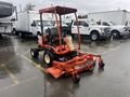 A 2010 Kubota F3680 lawn tractor with a red body and attached mower deck is shown in the foreground