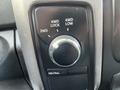 Control knob panel for 4WD settings in a 2015 RAM 1500 featuring positions for 2WD 4WD Lock and 4WD Low with a neutral button