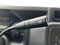 Close-up of the turn signal lever on a 2016 Ford Econoline van displaying the arrow indicator for left and right turns