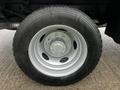 Close-up of a wheel from a 2017 Ford F-550 featuring a silver rim and a black tire with visible tread markings