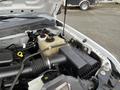 The image shows the engine compartment of a 2010 Ford F-250 SD with visible components such as a black air intake and a translucent coolant reservoir