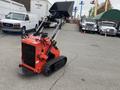 A red 2024 AGT Industrial LRT23 is shown with a front loader attachment and rubber tracks for mobility designed for landscaping and construction tasks