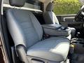 The interior of a 2015 RAM 5500 showing two front seats with a center console between them