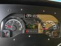 A dashboard of a 2012 Ford Econoline showing various gauges including speedometer tachometer fuel gauge and odometer reading 137456 km