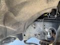 Close-up view of the undercarriage of a 2016 Ford F-250 SD showing metal components and a worn texture with a visible wiring harness