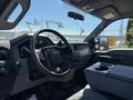 Interior view of a 2014 Ford F-250 SD focusing on the steering wheel dashboard and console