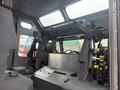 Interior view of a 2006 E-One Typhoon fire truck showing multiple black seats and equipment mounts