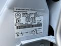 A 2016 Ford F-550 with a vehicle information label displaying specifications and compliance details