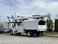 A 2020 Freightliner M2 bucket truck with a long extendable boom and a storage compartment on the side