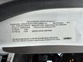 Label detailing vehicle emission control information for a 2020 Freightliner M2 including manufacturer VIN and regulatory class specifications