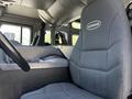Interior view of a 2006 Emergency One Fire Truck featuring a black fabric driver's seat with the word Superior on it