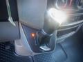 The gear shift of a 2017 Mercedes-Benz Sprinter with illuminated gear position indicator and a textured grip handle