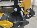 A close-up view of a 2024 AGT Industrial Yellow H13R Mini Excavator's bucket attachment featuring bolts and a sturdy design with yellow and black components