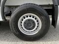 A close-up of a tire mounted on a 2017 Mercedes-Benz Sprinter featuring a silver wheel rim and black treaded tire with visible brand name and model details