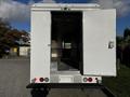 A 2017 Freightliner M Line truck with a wide open rear door revealing a spacious cargo area with metal flooring and silver walls