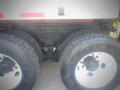 Close-up view of the rear dual tires and axle assembly of a 2016 International WorkStar 7500 truck with visible tread patterns and bolts on the axle