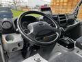 Interior view of a 2019 Hino 195 showing the steering wheel dashboard and gear shift with controls and display screen visible
