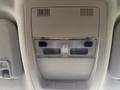 Interior overhead control panel of a 2013 Chevrolet Silverado 3500HD featuring lights and ventilation openings