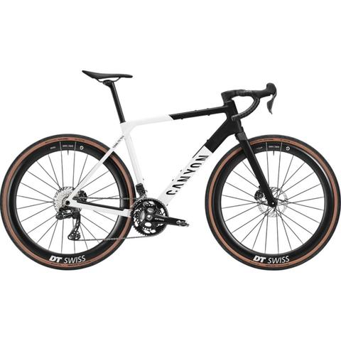 2026 Canyon Grail CF SLX 8 Di2 RS road bike in a sleek black and white design with wide tires and disc brakes showcasing modern cycling technology and performance features