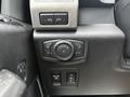 Control panel featuring various buttons for a 2018 Ford F-150 including light controls and a switch for fog lights