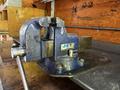 A blue JET bench vise with a sturdy base and jaws designed for securing objects during various tasks