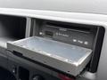A CD and DVD player with a slide-out tray labeled Strada designed for a 2009 Toyota Hiace