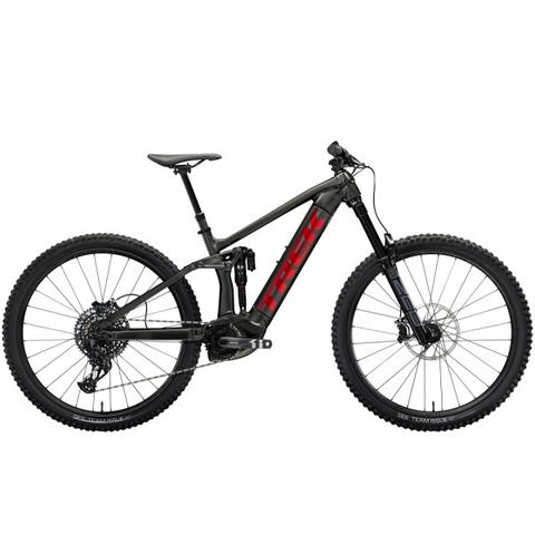 2023 Trek Rail 9 Gen 3 Electric Mountain Bike featuring a sleek black frame with a prominent red logo and equipped with wide tires and disc brakes