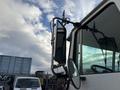 2010 Autocar Xpeditor with a prominent side mirror and antenna mounted on the driver's side