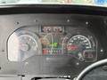 Dashboard of a 2012 Ford Econoline showing speedometer fuel gauge and odometer with a reading of 220320 km