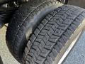 Close-up of two rugged tires on a 2015 RAM 5500 showing deep tread patterns designed for durability and traction