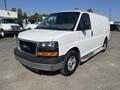 White 2016 GMC Savana van with a black front grille and silver bumper parked in a lot