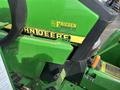 A green 2003 John Deere 790 tractor with yellow and black accents displaying the brand name and model