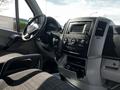 Interior of a 2017 Mercedes-Benz Sprinter showing the dashboard steering wheel and controls