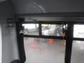 Inside view of a 2016 Chevrolet Express van showing a fogged window with a partially visible external scene containing other vehicles